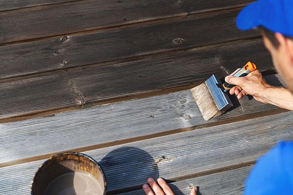 Man Staining Deck